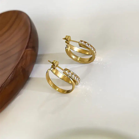 Women's geometric gold earrings close-up view