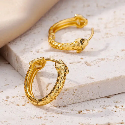 Close-up of minimalist gold-plated earrings in 18K gold plating