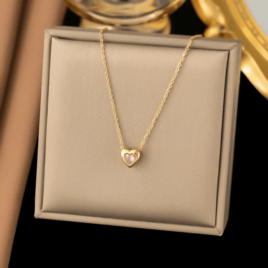 18K gold plated heart pendant necklace displayed on a soft beige jewelry box, showcasing its delicate design.
