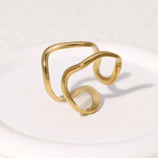 Gold plated geometric open ring featuring a trendy hollow-out design on a white background.