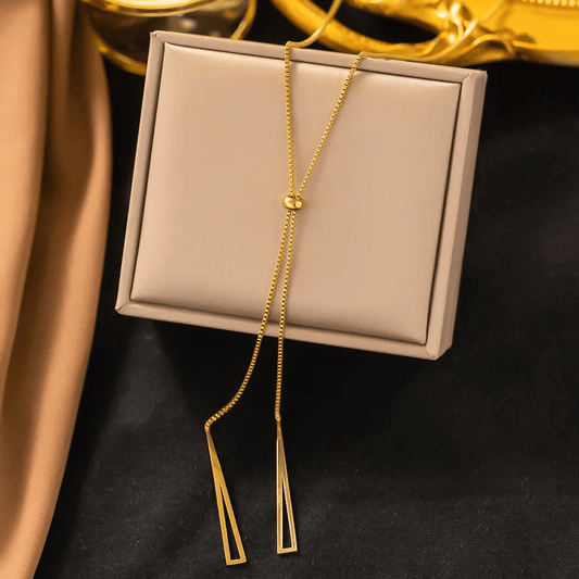 18K gold plated pendant necklace displayed on a cream box, showcasing its elegant design.