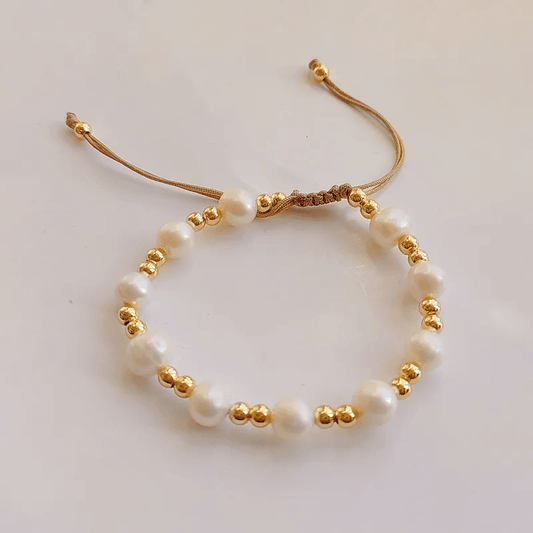Trendy geometric bracelet for women featuring natural freshwater pearls and gold accents in a unique design.