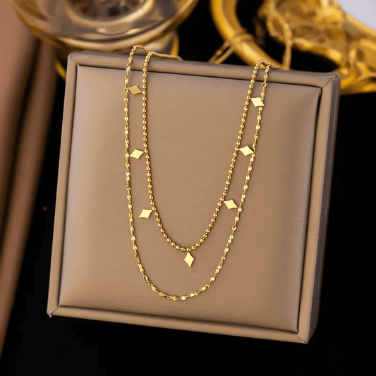 18K gold plated pendant necklace displayed on a gift box, featuring layered chain design.