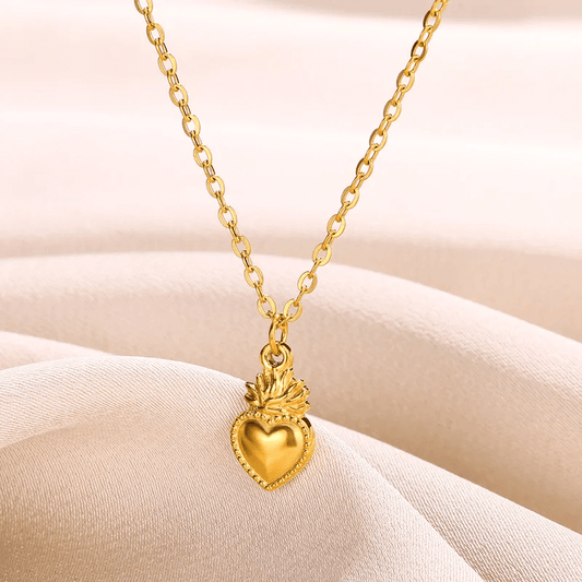 18K gold plated heart pendant necklace on a silky background, showcasing classic style and durability.