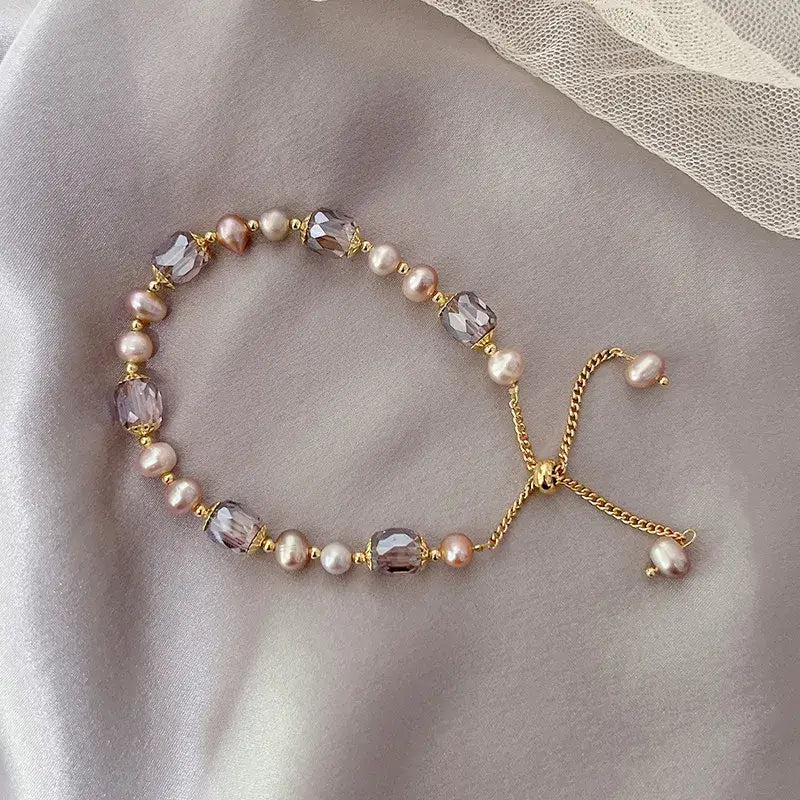 Close-up of pearl bracelet showing smooth round beads