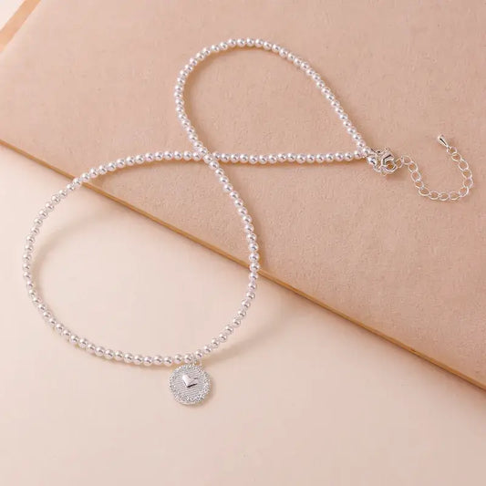 Close-up of Freshwater pearl pendant necklace showcasing delicate pearl beads