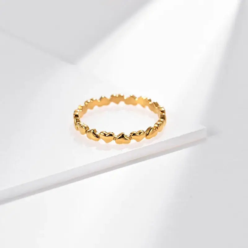 Heart-shaped ring on a white background