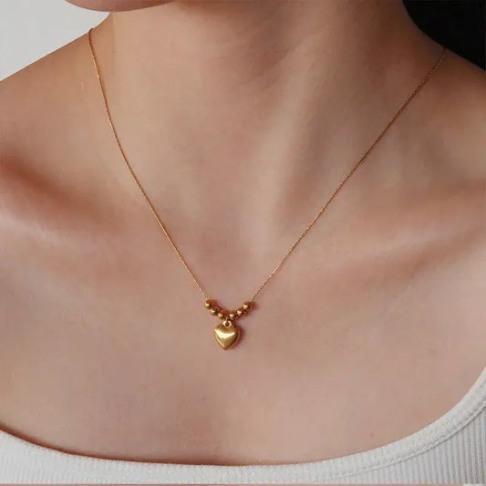 Close-up of Gold heart pendant necklace pendant