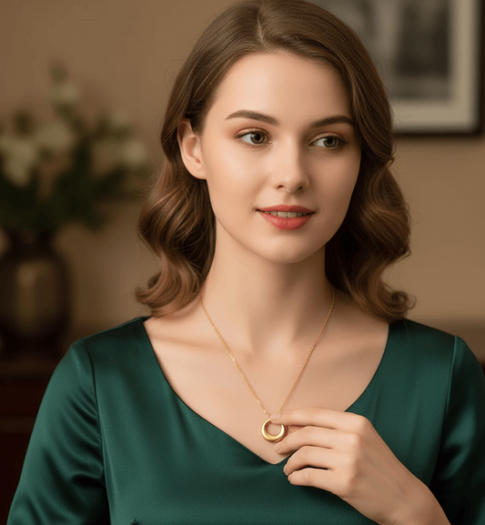 Model wearing an 18K gold-plated pendant necklace, showcasing elegance and sophistication in a stylish setting.