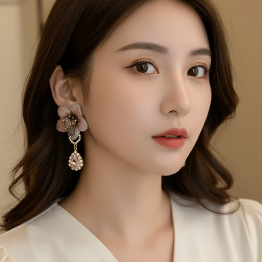 Geometric Bow Knot Earrings – Elegant Pearl & Zircon Design worn by a model, showcasing charm and style.