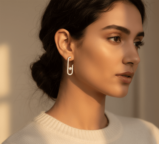 Geometric hairpin stud earrings featured on a model showcasing their minimalist elegance and luxurious design.