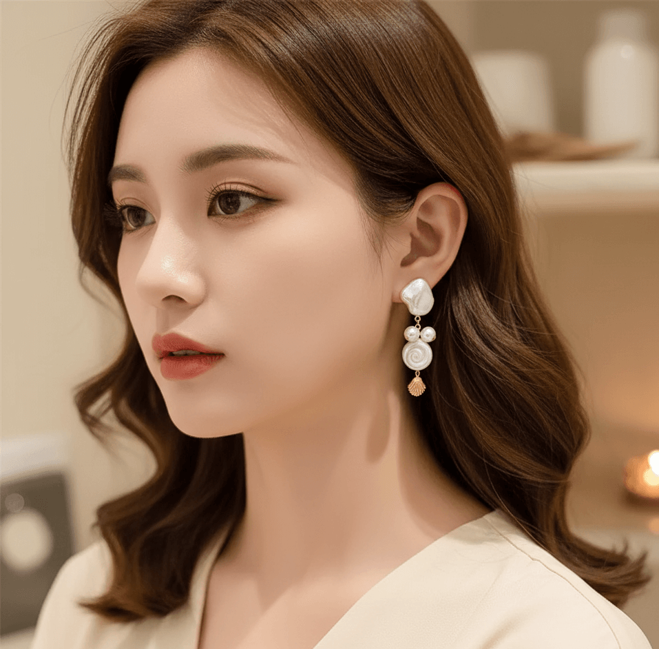 Close-up of a woman wearing summer shell tassel earrings with a chic, elegant design.