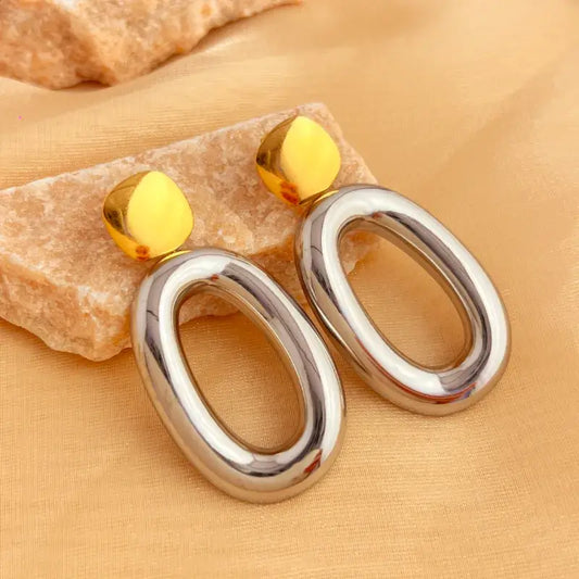 Stainless steel drop earrings with retro oval hollow design