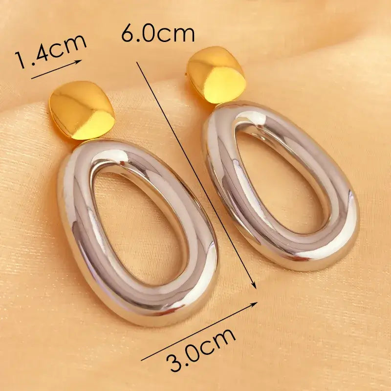 Stainless steel drop earrings styled with casual and formal outfits