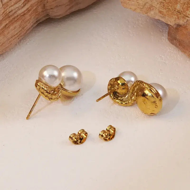 Close-up of stainless steel stud earrings showing gold plating