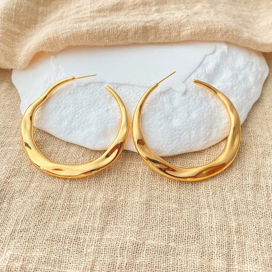 Irregular copper stud earrings with sleek plated finish