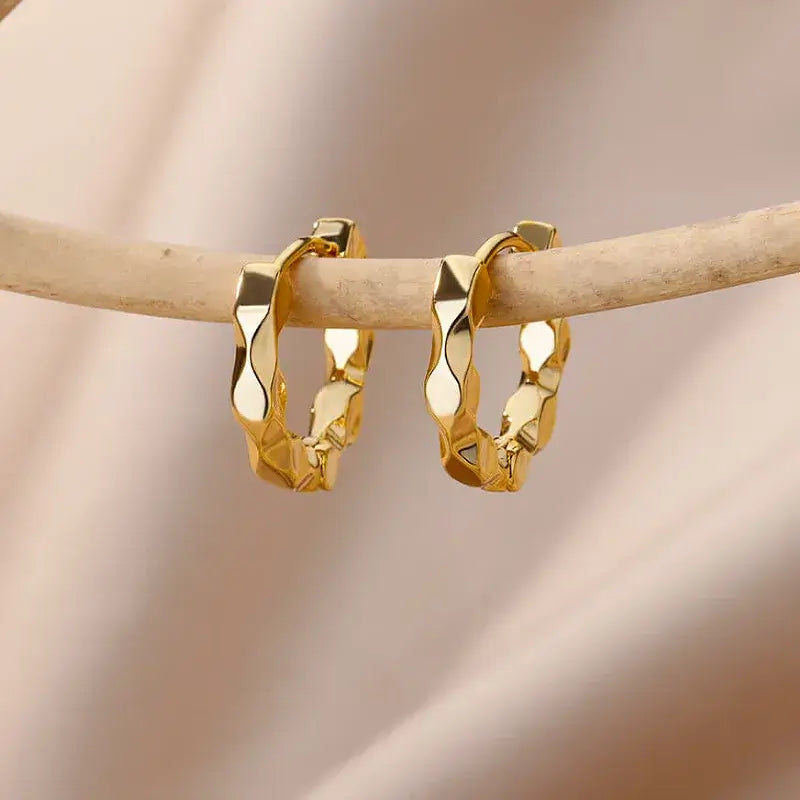 Front view of simple gold-plated earrings with elegant design