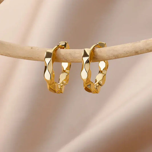 Front view of simple gold-plated earrings with elegant design