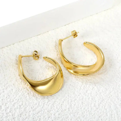 C-shaped stainless steel stud earrings styled with casual and formal outfits