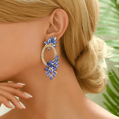 Shiny wreath petal drop earrings worn by a model with elegant hairstyle and graceful pose.