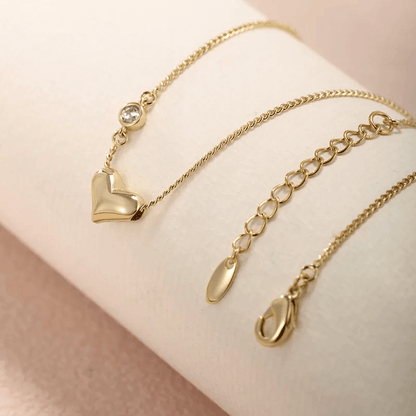 Heart shape gemstone necklace with gold alloy chain and sparkling detail for women.