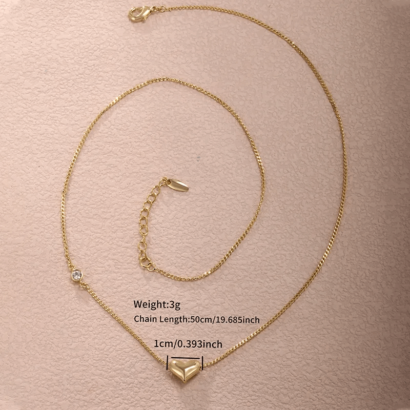 Heart shape gemstone necklace featuring gold alloy, 50cm chain length, and sparkling details.