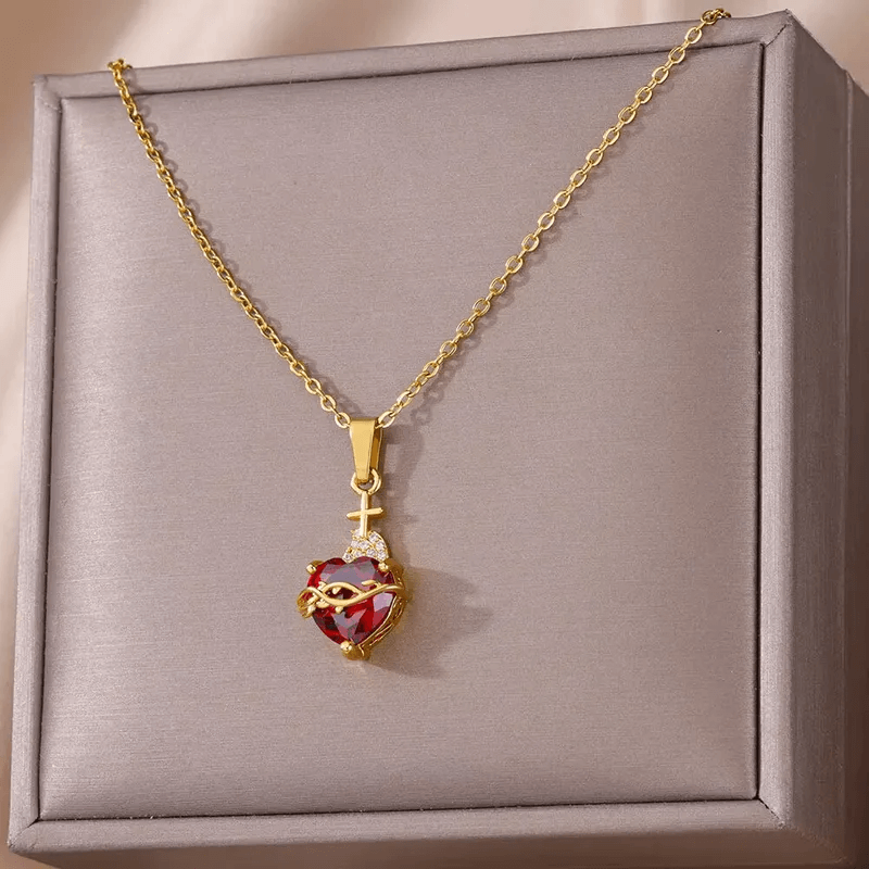 Gold Plated Heart Pendant Necklace – Titanium Steel showcased in an elegant box with red gem detail.