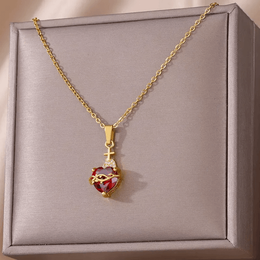 Gold Plated Heart Pendant Necklace – Titanium Steel showcased in an elegant box with red gem detail.