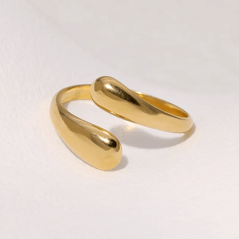 Woman wearing gold geometric open ring with casual outfit