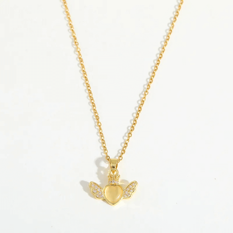 Heart Pendant Necklace – 18K Gold Plated for Women with winged heart charm and shiny details.