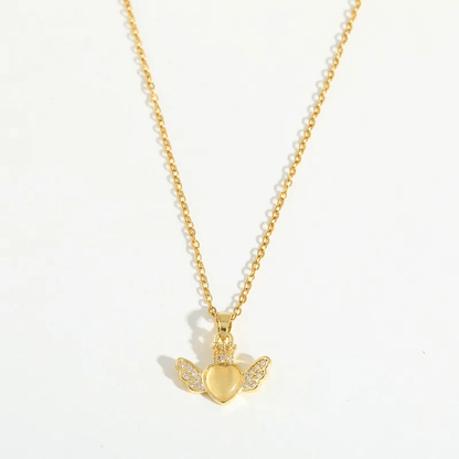 Heart Pendant Necklace – 18K Gold Plated for Women with winged heart charm and shiny details.