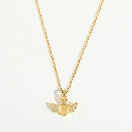 Heart Pendant Necklace – 18K Gold Plated for Women with winged heart charm and shiny details.