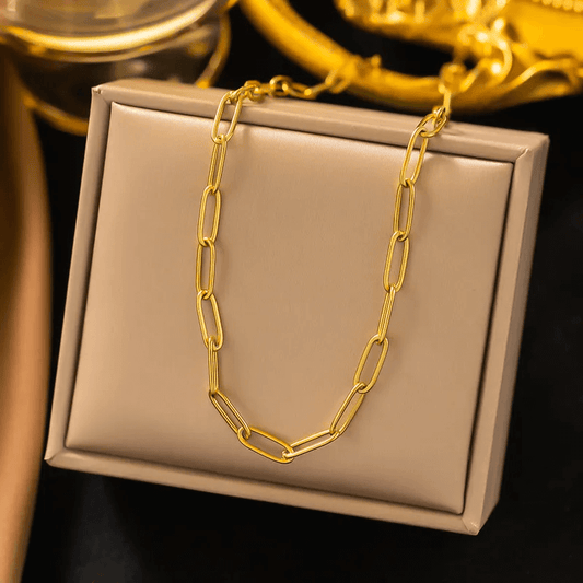 Gold Plated U-shape Heart Pendant Necklace for Women displayed on a soft beige box with golden accessories.