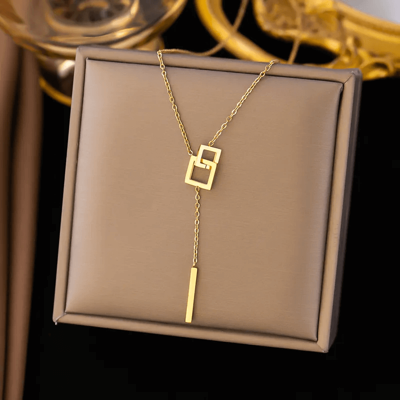 U-shape Heart Pendant Necklace – 18K Gold Plated displayed on a jewelry box showcasing its modern design.