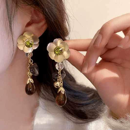 Heart Bow Knot Earrings – Geometric Pearl & Zircon Design worn by a woman, showcasing playful elegance and sophistication.