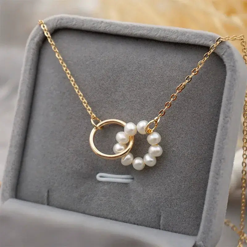 Freshwater pearl round pendant necklace displayed on jewelry stand