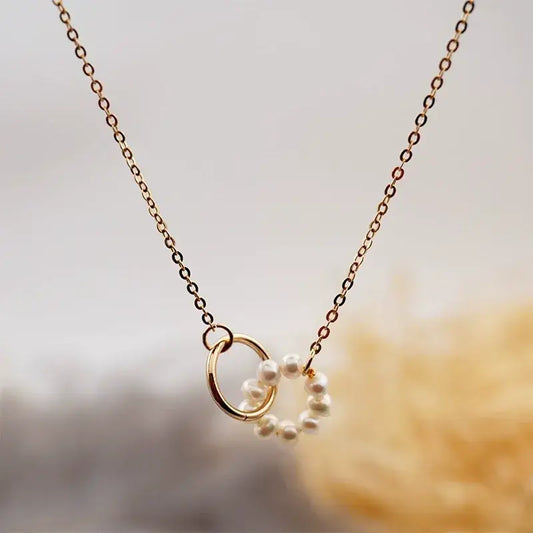 Freshwater pearl round pendant necklace with stainless steel chain and copper plating