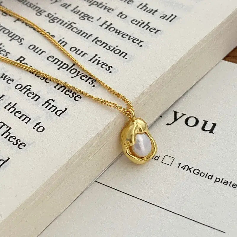 Water droplet pearl pendant necklace worn by model for daily or formal wear