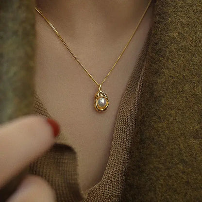Close-up of water droplet pearl pendant necklace showing artificial pearl