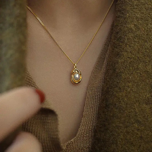 Close-up of water droplet pearl pendant necklace showing artificial pearl