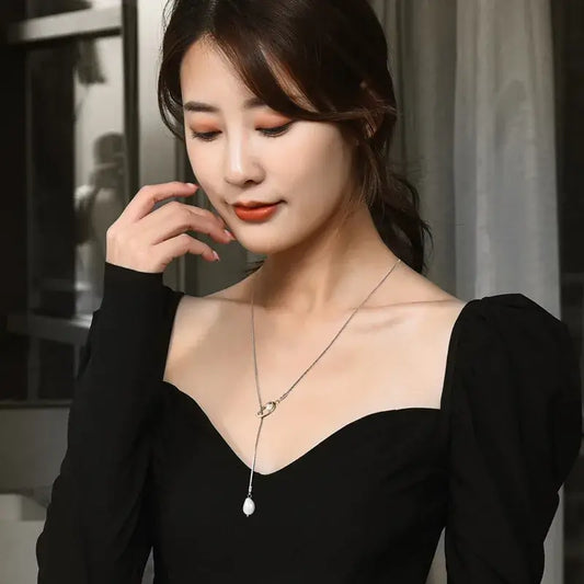 Close-up of Minimalist geometric Y-shaped necklace pendant