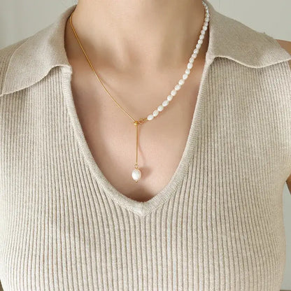Geometric titanium steel necklace displayed on a jewelry stand