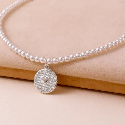 Freshwater pearl pendant necklace with beaded chain and round copper pendant