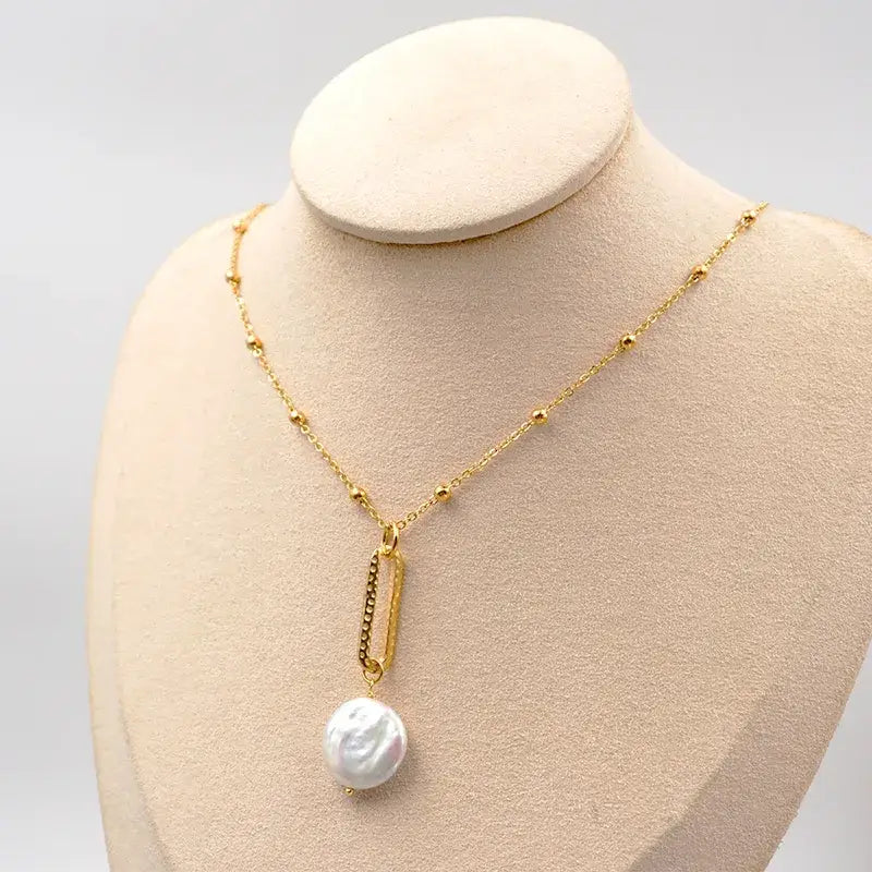 Baroque freshwater pearl necklace displayed on jewelry stand