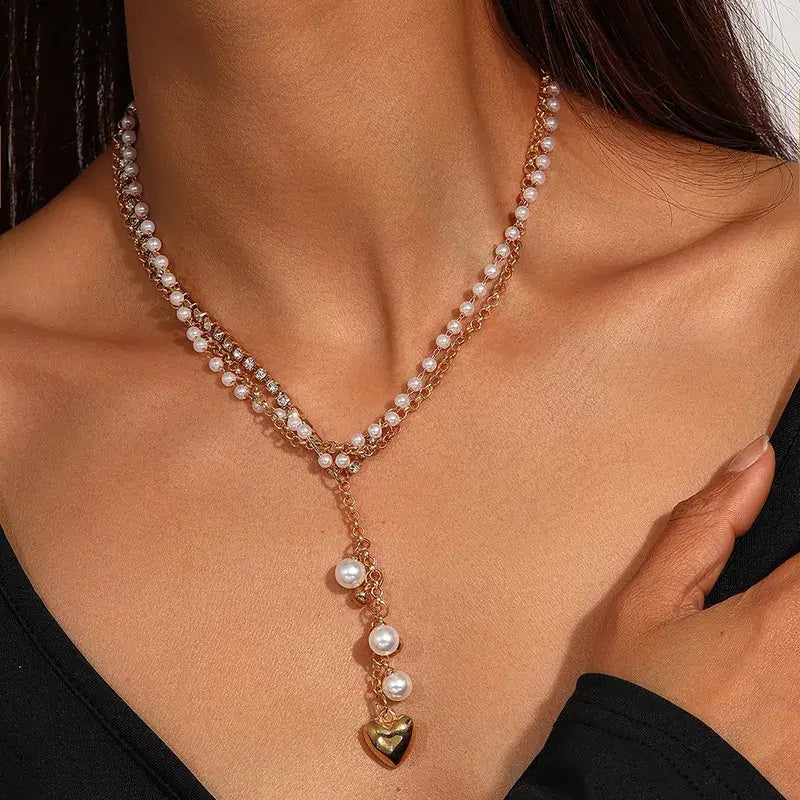 Model wearing Bohemian heart necklace with elegant outfit