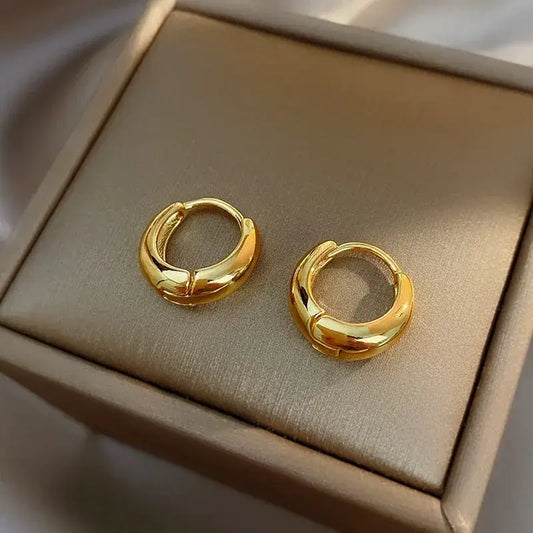 Women's 18K gold earrings close-up view