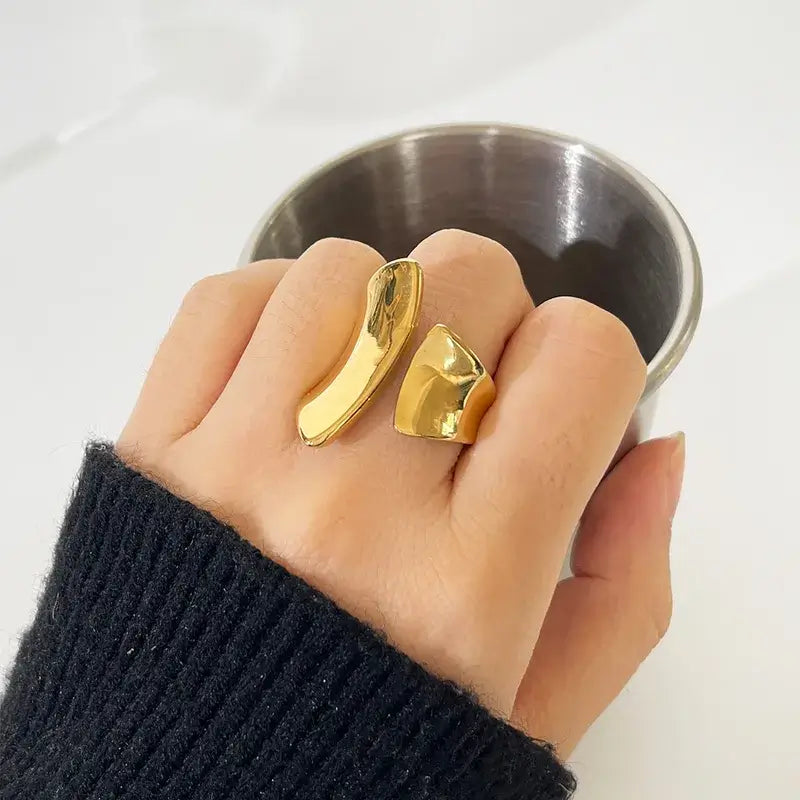 retro irregular gold plated ring displayed on jewelry stand