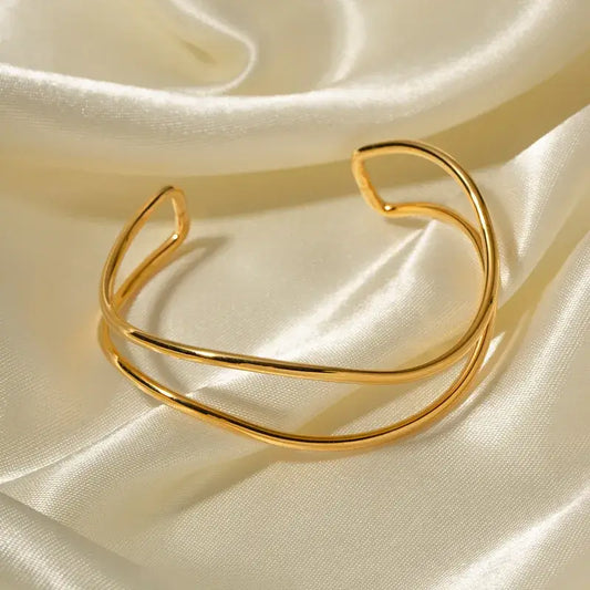 Gold-plated sea wave bangle with flowing curved design