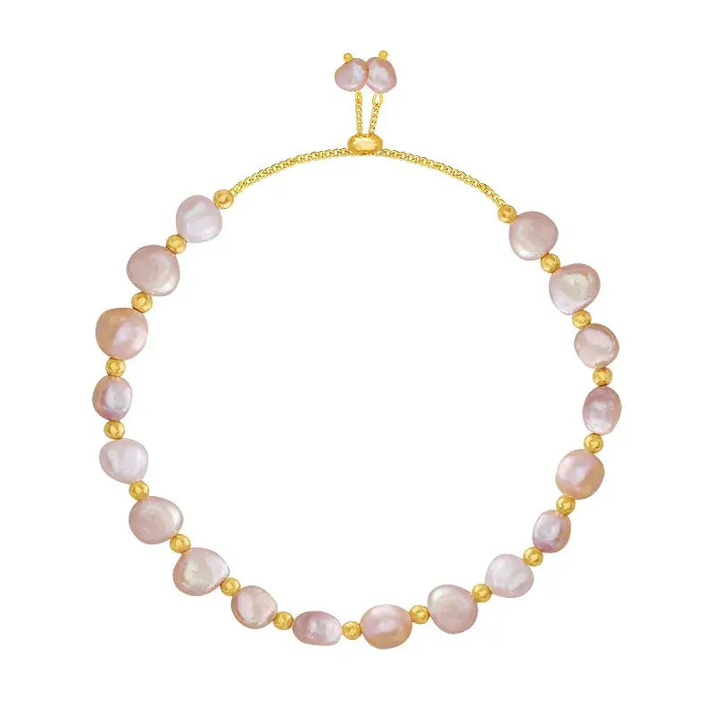 Stacked bracelets featuring freshwater pearl bracelet