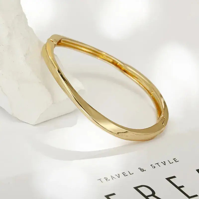 Woman wearing Simple Style Solid Color Alloy Bangle stacked with other bracelets
